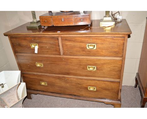 An early 20th Century mahogany chest of two short and two long drawers with recessed brass handles, raised on Georgian style 