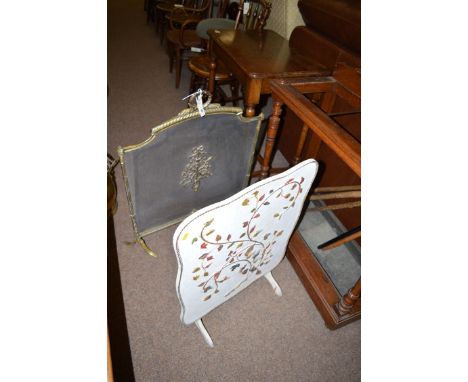 A Victorian cast brass and wire mesh spark guard with ornate shaped top and decorative central panel; and a white painted mid