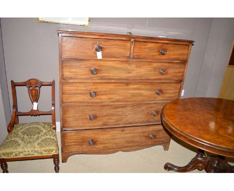 A 19th Century mahogany chest of two short and four long graduated drawers fitted turned handles, raised on bracket feet.