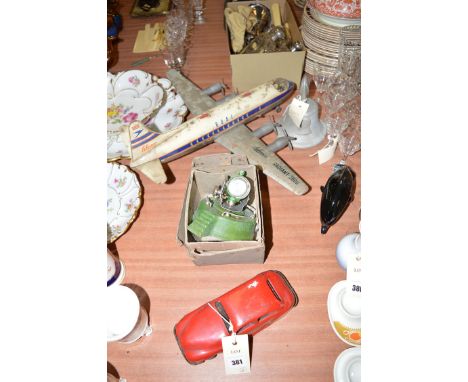 A Schuco Radiant 560 BOAC four engine passenger aeroplane; an Astra toy search light, boxed; and a 'Chad Valley' toy motorcar