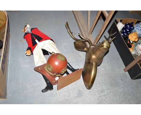 A cast aluminium deer's head and antlers; a figure of a huntsman in hunting uniform with foxes head; and a reproduction minia