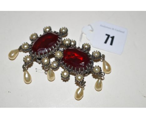 A pair of Christian Dior ear clips, by Mitchell Mayer, with faux pearls, red stone and faux pearl drops in metal.