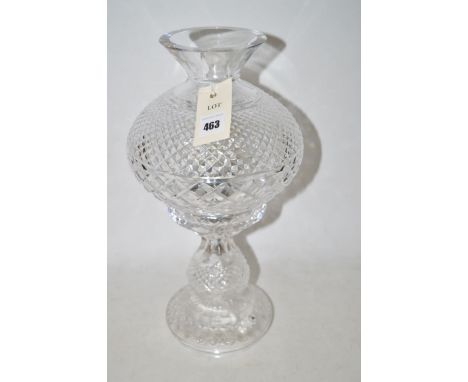 A cut glass electric table lamp and shade.