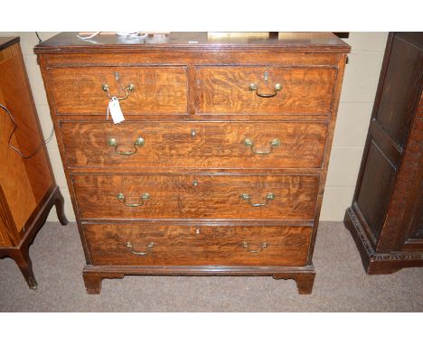A 19th Century oak chest of two short and three long drawers with brass swan neck handles, raised on bracket feet.