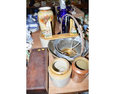 An antique candle box containing assorted tools; two brass jam pans; three stoneware storage jars; a Victorian vase; a blue g