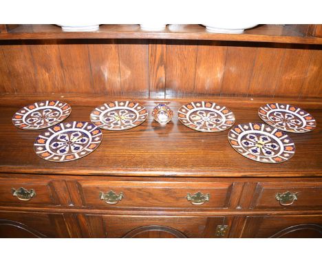 A set of six Royal Crown Derby Imari plates, pattern no. 1128; and a small oval matching trinket dish.  (7)