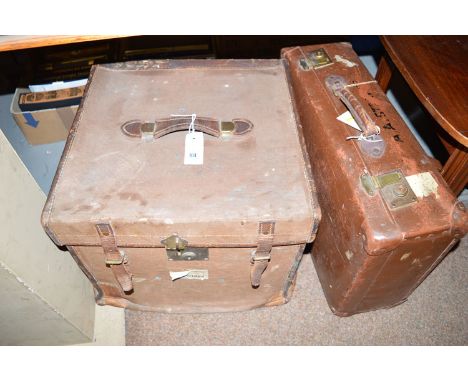 A 19th Century square-shaped canvas covered trunk with leather trim and brass clasp, bearing a North Eastern Railways label '
