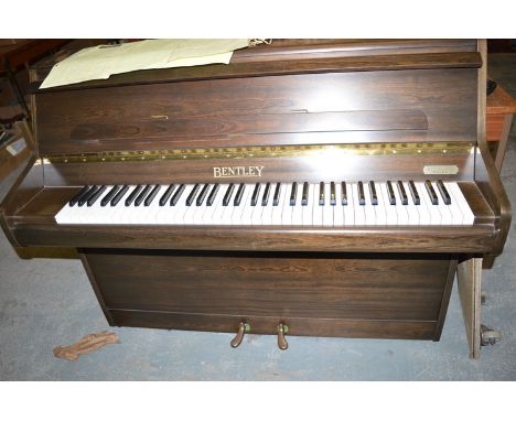 A Bentley Compact piano in stained wood case,( seventy three keys).