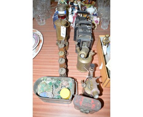 Two metal railway lamps; an English electric auto fire damp protector and alarm; a brass miners lamp; and four miniature mine