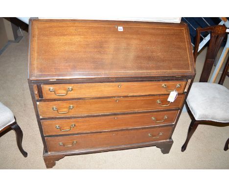 An Edwardian mahogany inlaid bureau with barber pole stringing overall, the fall-flap opening to reveal a fitted interior of 