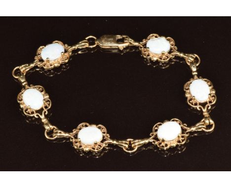 A 9ct gold bracelet set with opal cabochons, 11.6g, 19cm&nbsp;