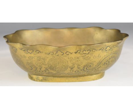 Chinese brass bowl with fluted rim, dragon decoration and seal mark to base, L22xD16.5xH7cm.&nbsp;