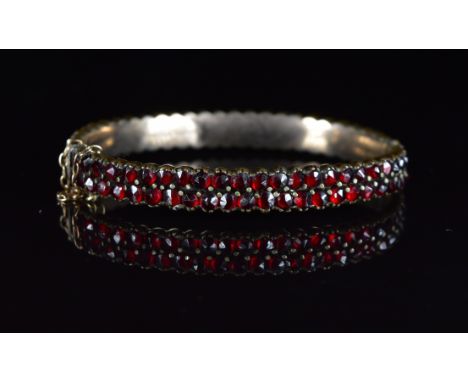 Silver gilt bangle set with Bohemiam cut garnets, 18.2g, 4.5 x 5.8cm&nbsp;