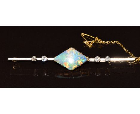 A c1920 9ct gold brooch set with black opal and four diamonds with a platinum finish, 5.5g, 6cm