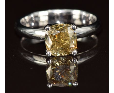 A platinum ring set with a 2.14ct deep yellow/green cushion cut diamond, with certificate, 4g, size N