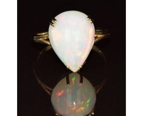 A 9ct gold ring set with a pear cut opal cabochon, 3.5g, size P