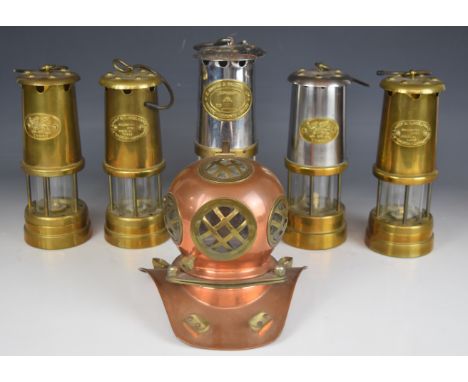 Five miner's lamps including Thomas and Williams, Cambrian, Lamp and Limelight Company etc, and a&nbsp;miniature model diver'