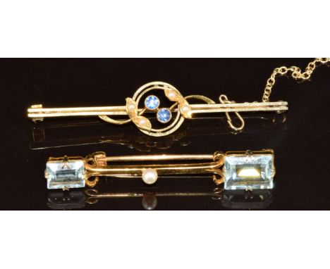 A 9ct gold brooch set with two aquamarines and a pearl (3.8g, 4.5cm) and a 15ct gold brooch set with seed pearls and sapphire