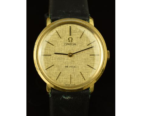 Omega De Ville gentleman's wristwatch ref. 111.077 with black hands, gold and black hour markers, gold dial, gold plated case