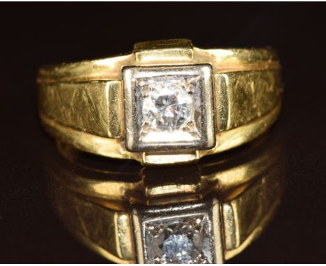 An 18ct gold ring set with a round cut diamond of approximately 0.35ct in a square setting, 13.2g, size T