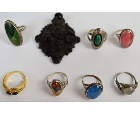 Six silver rings including Arts &amp; Crafts moonstone, Navajo turquoise, agate etc, a gold plated ring and a Victorian carve