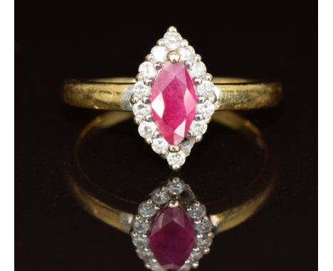 An 18ct gold ring set with a marquise cut ruby surrounded by diamonds (one missing), 3.7g, size N