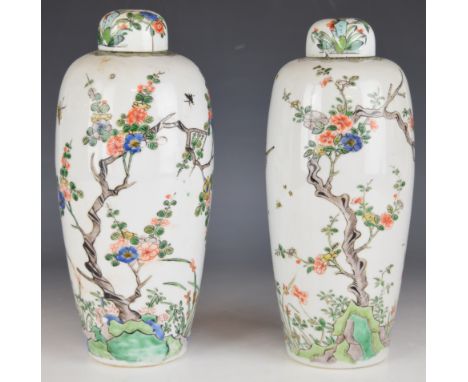 Pair of 18th/19thC Chinese famille verte baluster vases and covers with old collector's / sales label to the base of one stat