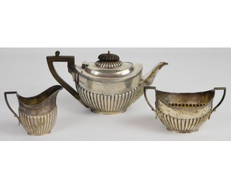 Edward VII hallmarked silver bachelor's tea set with fluted lower bodies and gadrooned edges, inscribed to Miss E Brett from 