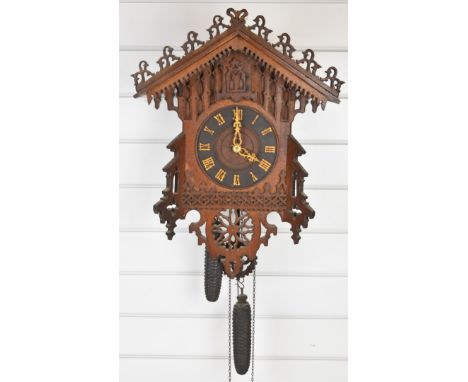 19th/ 20th century cuckoo clock with pierced and carved decoration, overall height of clock 53cm