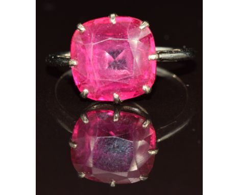 An 18ct white gold ring set with a synthetic ruby, 3.6g, size Q