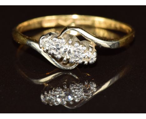 An 18ct gold ring set with diamonds in a platinum setting, 2.3g, size P