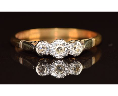 An 18ct gold ring set with three diamonds in a platinum setting, 2.5g, size P