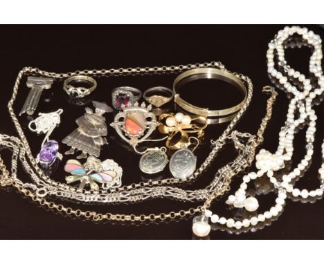 A collection of silver jewellery including five chains, two pendants, two brooches, christening bangle, two rings and a pearl