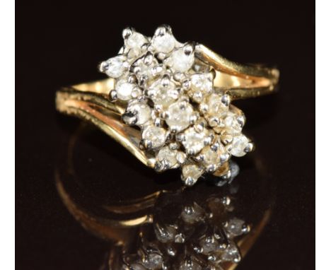 A 14k gold ring set with diamonds in a cluster, 4.5g, size N