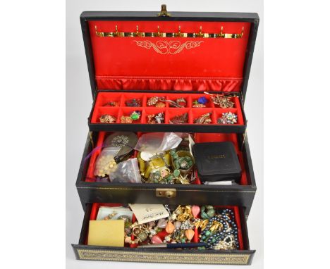 A collection of jewellery including Grome earrings, Monet earrings, silver ring in the form of two ram's heads, silver brooch