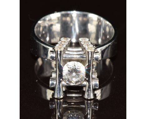 An 18ct white gold ring designed by Marco Oldani for John Rasmussen and set with diamonds, the largest approximately 0.6ct an