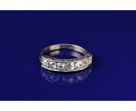 An 18ct white gold half eternity ring set with seven graduated old cut&nbsp;diamonds of approximately 0.15ct to 0.2ct, 3.8g, 