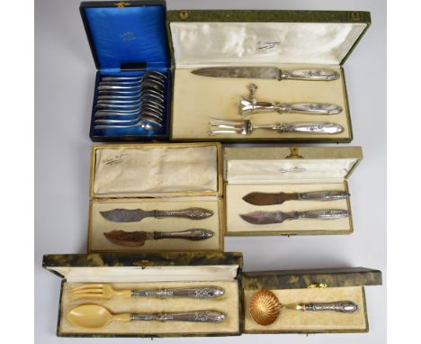 Cased French cutlery comprising white metal handled sifter ladle, two similar pairs of serving knives, salad servers with ivo