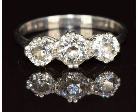 An 18ct white gold and platinum ring set with three diamonds of approximately 0.6, 0.3 &amp; 0.3ct, 2.6g, size P