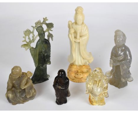 A collection of Chinese jade or similar hardstone / glass figures including Guanyin, Buddha etc., tallest 23cm