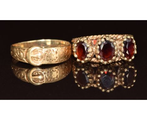 A 9ct gold ring set with three garnets and a 9ct gold buckle ring, 6g, size K &amp; P