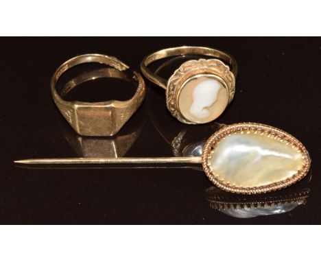 A 9ct gold cameo ring, 9ct gold signet ring (5.5g, damaged) and 9ct gold stick pin set with mother of pearl, 4.4g, 5.5cm