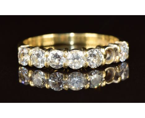 An 18ct gold half eternity ring set with six diamonds, each approximately 0.14ct (one missing), 2.7g, size N