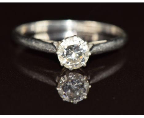 A platinum ring set with a round cut diamond of approximately 0.5ct, 2.4g, size O