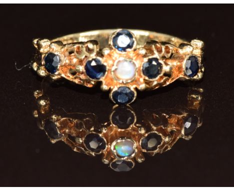 A 9ct gold ring set with an opal and sapphires, 2g, size K