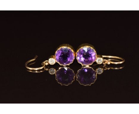 Edwardian pair of yellow metal earrings each set with a round cut amethyst and diamond (test as 9ct gold), 1.8g&nbsp;