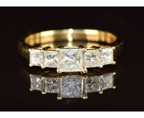 An 18k gold ring set with five princess cut diamonds, the centre diamond approximately 0.45ct, 3g, size N
