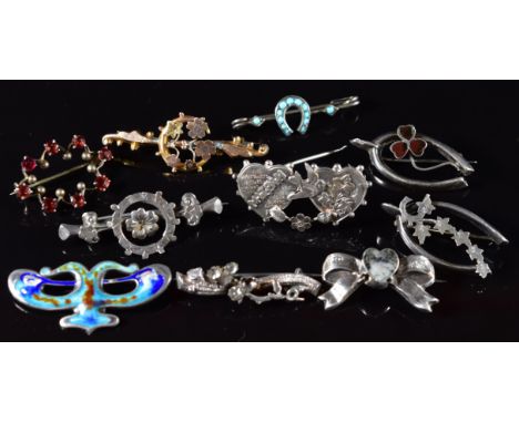 Nine c1900 silver brooches including Mizpah, bow, shamrock, wishbone, enamel, horseshoe, etc and 9ct gold brooch (1.5g, damag