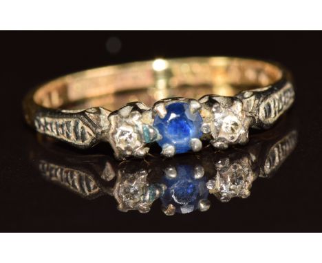 An 18ct gold ring set with a sapphire and diamonds, 2g, size K