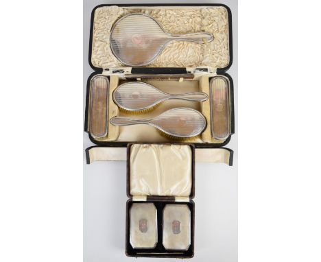 Hallmarked silver dressing table comprising hand mirror, two pairs of brushes and a comb, Birmingham 1918, maker&nbsp;Levi &a